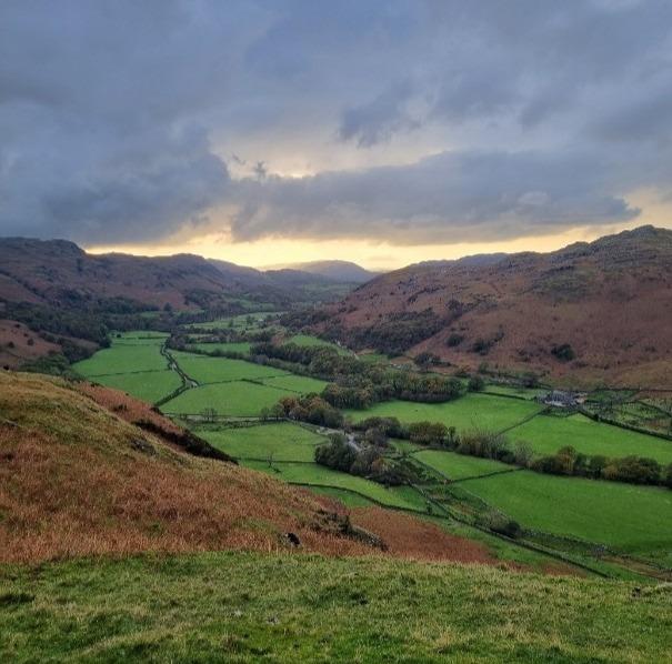 Cloudy farmland valley